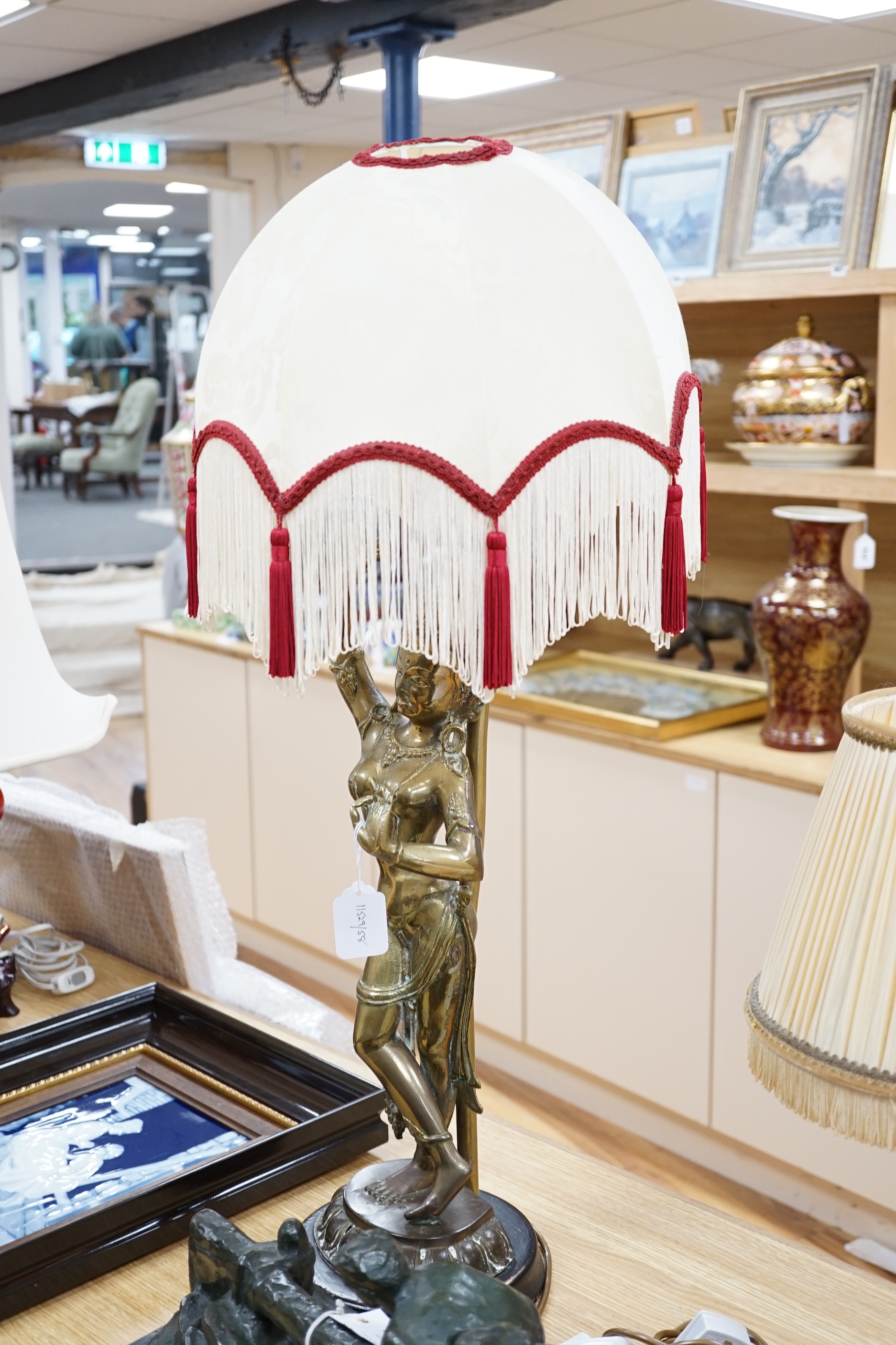 A vintage Indian polished brass figure of a dancer on lotus base, now mounted as a lamp, 80cm including shade